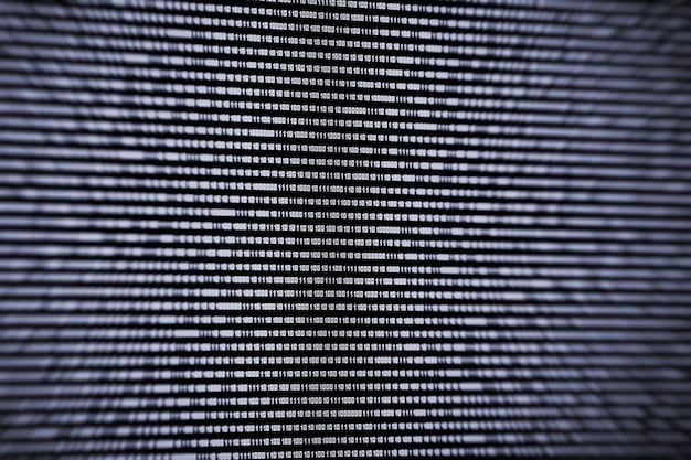 A close-up of a computer screen displaying lines of code intermingled with news headlines, symbolizing the complex relationship between AI algorithms and news content. The image should have a tech-focused aesthetic, with data visualizations and abstract representations of algorithms.