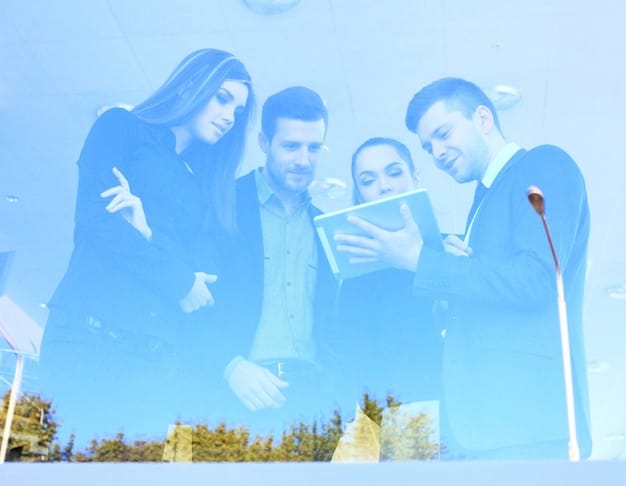 A split image depicting the contrast between an engaged, collaborative team in a bright, modern office on one side, and a disengaged, isolated employee in a dimly lit cubicle on the other. The image is divided vertically to emphasize the difference in work environments and employee attitudes.