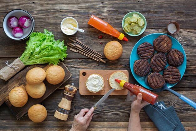 An arrangement of various plant-based meat and dairy alternatives, including burgers, sausages, milk, and cheese, showcasing the diversity of options available.